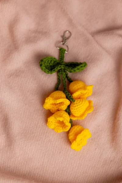 Handmade crochet yellow tulip flower keyring with green stem made by artisan crafters Australia
