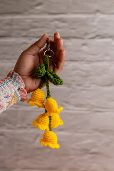 Yellow crochet tulip keyring clipped to keys handmade by artisan crafters shipped from Melbourne