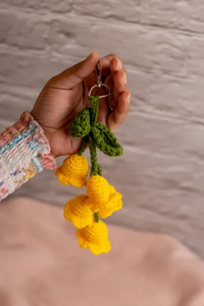 Yellow crochet tulip keyring clipped to keys handmade by artisan crafters shipped from Melbourne