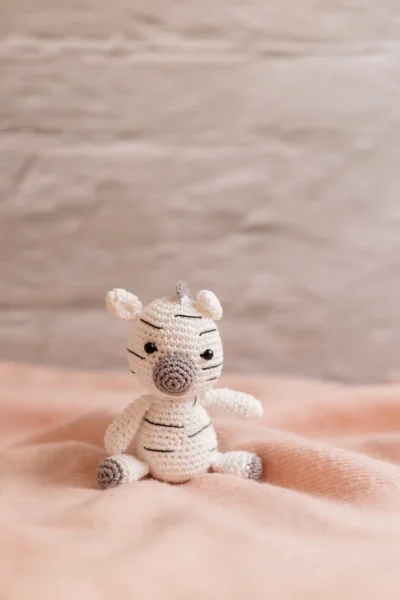Handmade crochet zebra rattle and toy set with soft zebra companion and matching sensory rattle made by artisan crafters newborn gift Australia