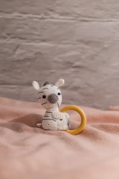 Handmade crochet zebra rattle and toy set with soft zebra companion and matching sensory rattle made by artisan crafters newborn gift Australia