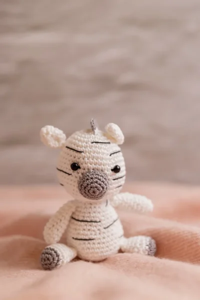 Handmade crochet zebra rattle and toy set with soft zebra companion and matching sensory rattle made by artisan crafters newborn gift Australia