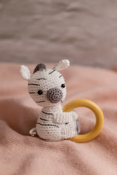 Handmade crochet zebra rattle and toy set with soft zebra companion and matching sensory rattle made by artisan crafters newborn gift Australia