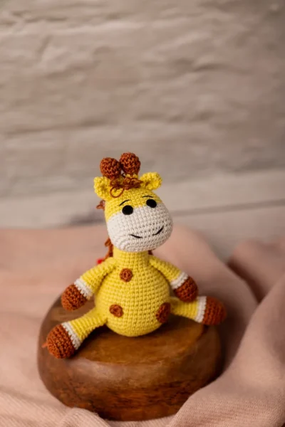 Handmade crochet amigurumi giraffe soft toy in natural colours made by artisan crafters safe for newborns and toddlers Australia