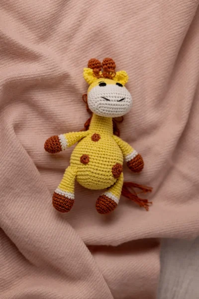 Handmade crochet amigurumi giraffe soft toy in natural colours made by artisan crafters safe for newborns and toddlers Australia