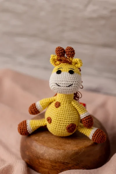 Handmade crochet amigurumi giraffe soft toy in natural colours made by artisan crafters safe for newborns and toddlers Australia
