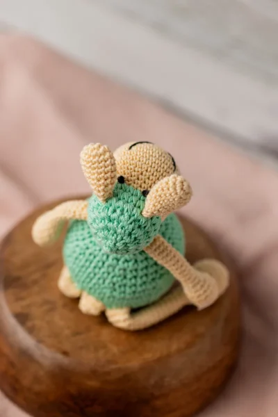 Aster the sheep crochet toy seated upright on nursery shelf showing soft white woolly texture ethical handmade gift Melbourne
