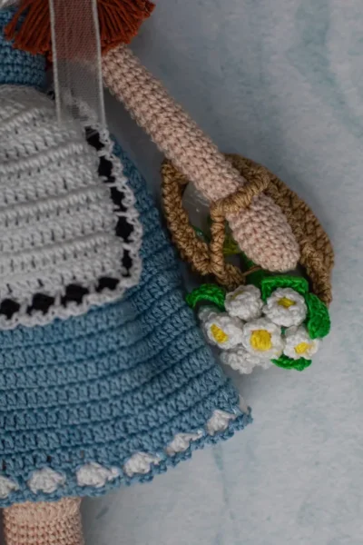 Bella the doll full body view showing soft crochet cotton yarn dress and hand stitched features ethical handmade toy Melbourne