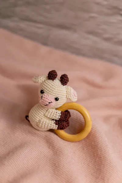 Handmade crochet cow rattle and toy set with soft cow companion and matching rattle made by artisan crafters newborn gift Australia