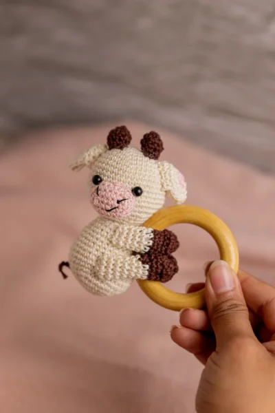 Handmade crochet cow rattle and toy set with soft cow companion and matching rattle made by artisan crafters newborn gift Australia