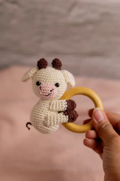 Handmade crochet cow rattle and toy set with soft cow companion and matching rattle made by artisan crafters newborn gift Australia
