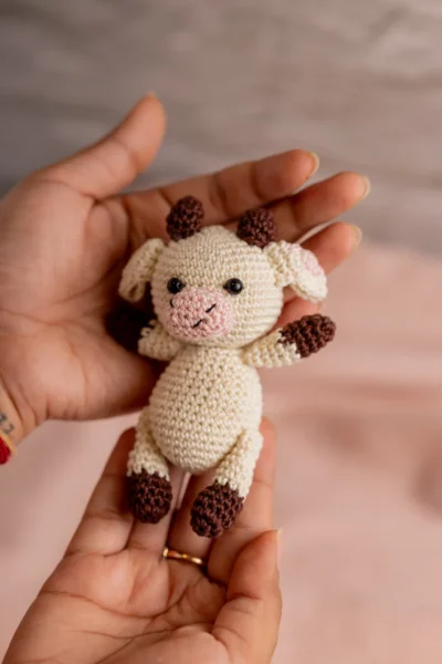 Handmade crochet cow rattle and toy set with soft cow companion and matching rattle made by artisan crafters newborn gift Australia