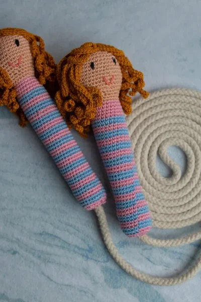 Cute doll skipping rope showing full length rope with crochet doll handles at each end handmade active play toy Melbourne