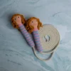 Cute doll skipping rope showing full length rope with crochet doll handles at each end handmade active play toy Melbourne