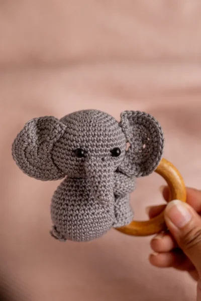 Crochet elephant rattle and toy set in nursery context soft ethical handmade baby gift shipped from Melbourne Australia
