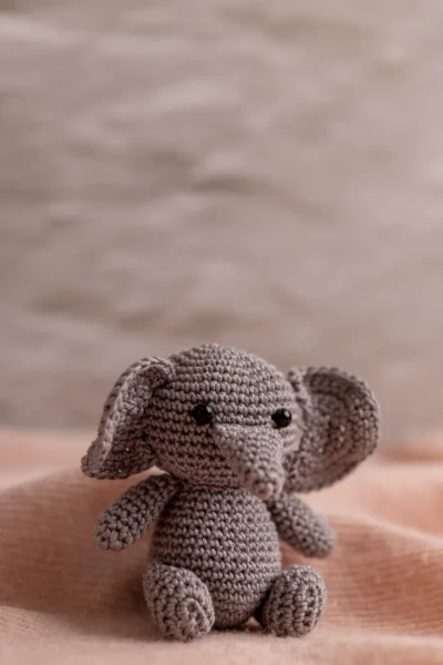Crochet elephant rattle and toy set in nursery context soft ethical handmade baby gift shipped from Melbourne Australia