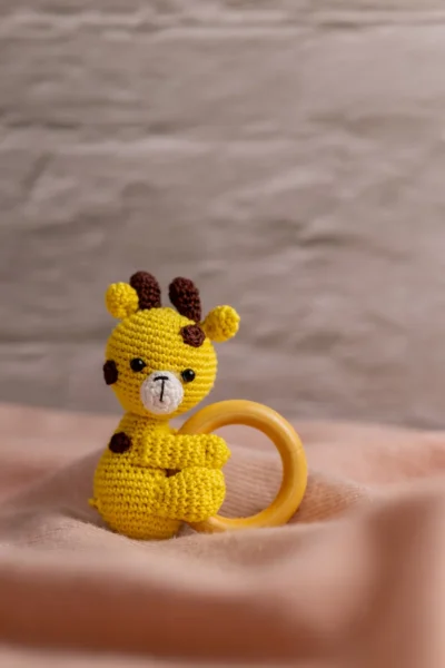 Handmade crochet giraffe rattle and toy set with soft giraffe companion and matching rattle made by artisan women in India newborn gift Australia