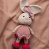 Handmade crochet amigurumi bunny rabbit in pink dress with matching bow made by artisan crafters soft toy gift Australia