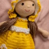 Handmade amigurumi doll in yellow floral dress styled on shelf keepsake soft toy gift shipped from Melbourne Australia